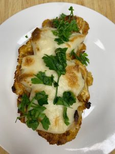 Cauliflower steaks with vegan mozzarella and Parmesan