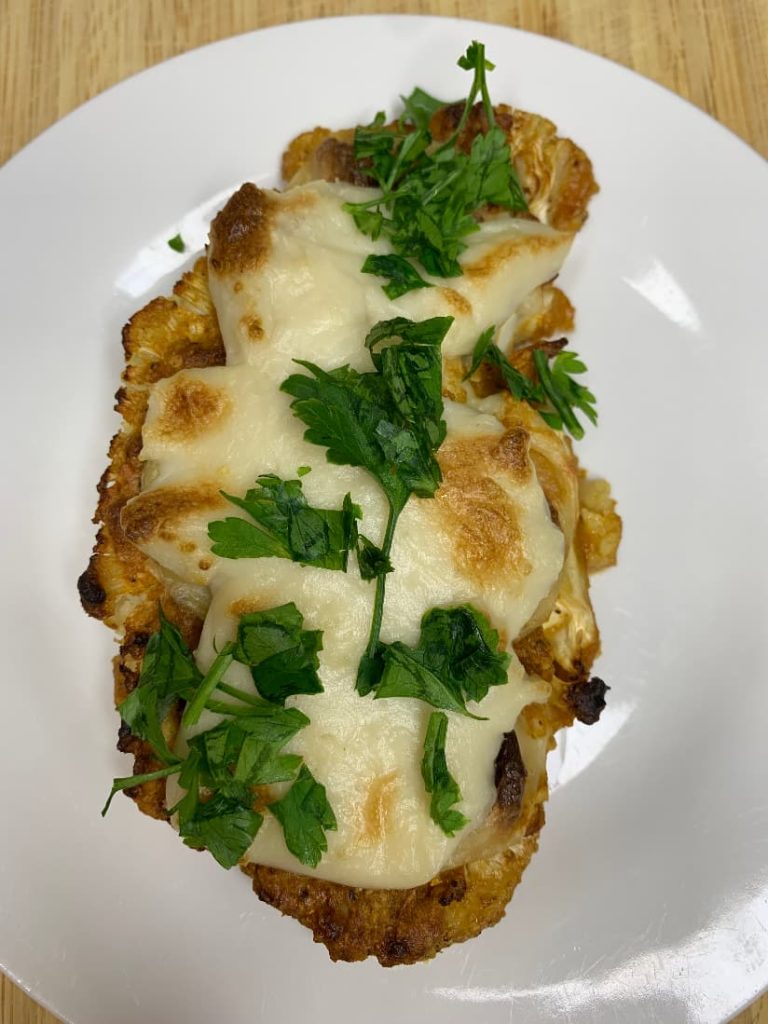 Cauliflower steaks with vegan mozzarella and Parmesan